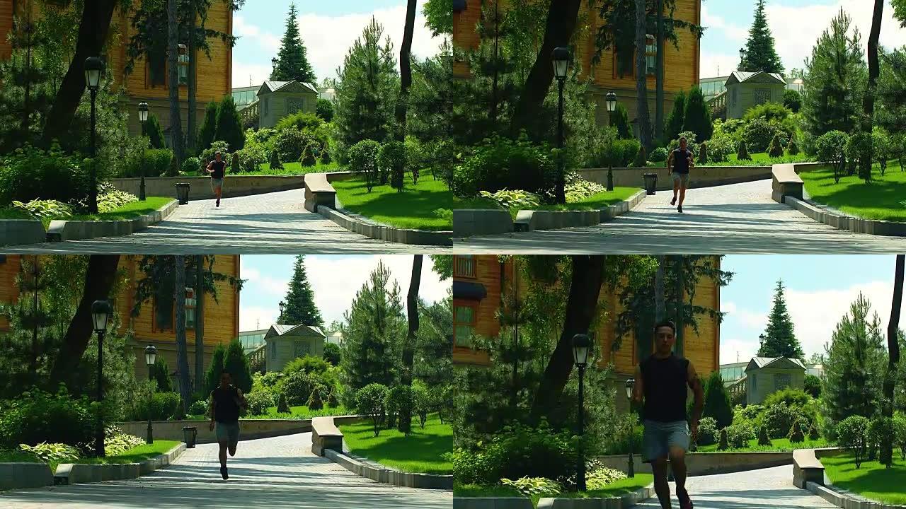 人在公园路跑。在公园小巷慢动作奔跑的男跑步者
