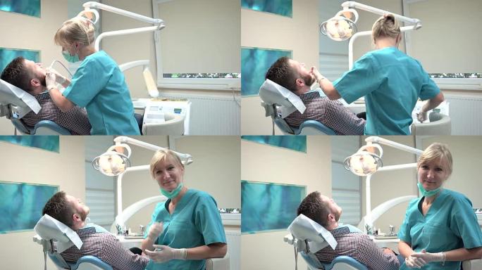 女牙医钻牙齿，看着镜头。滑块镜头，左。