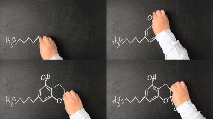 四氢大麻酚并画出了他的化学式。黑板上THC分子的结构模型。