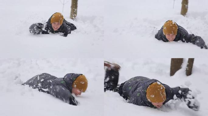 男孩在雪地里玩耍