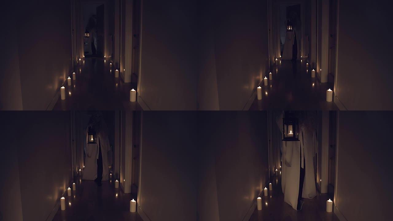 4k惊悚片在长长的大厅里用蜡烛拍摄，女孩用枝形吊灯移动