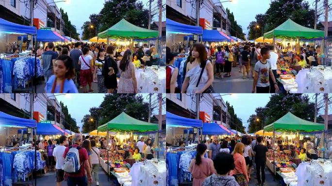 时间流逝: 泰国清迈夜市步行街的人群