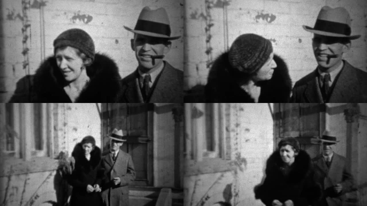 1933: 软呢帽男子在黑色皮大衣中与忠诚的妻子抽雪茄。