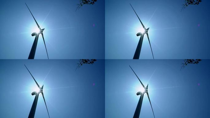 阳光明媚的蓝天中的风力涡轮机为地球提供新时代的能源