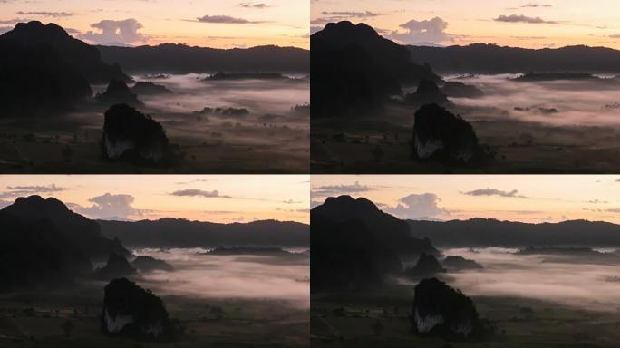 在泰国Phu Lang Ka的晨雾中，阳光的延时