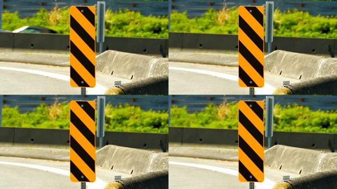 黄色障碍交通标志，街道上的警告条纹图案