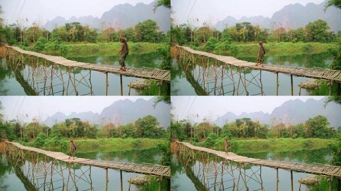 走在竹桥上的旅游女孩，旺旺，老挝