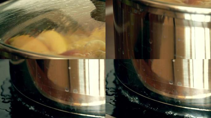 在锅里煮食物。水滴在热的烹饪表面上。全高清特写视频