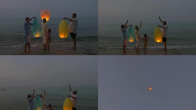 沙滩上的家庭飞行天灯