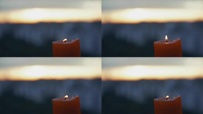 烛光争吵在模糊的日落景色后面的右上角