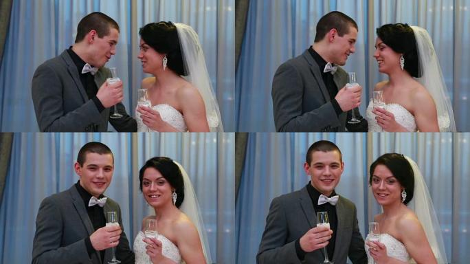 新婚夫妇在婚礼上喝香槟
