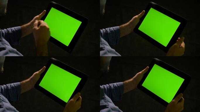 使用绿屏平板电脑并放大和缩小显示屏的人