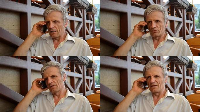 白发苍苍的老人在电话特写中交谈