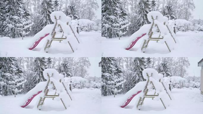 滑梯和秋千被雪覆盖