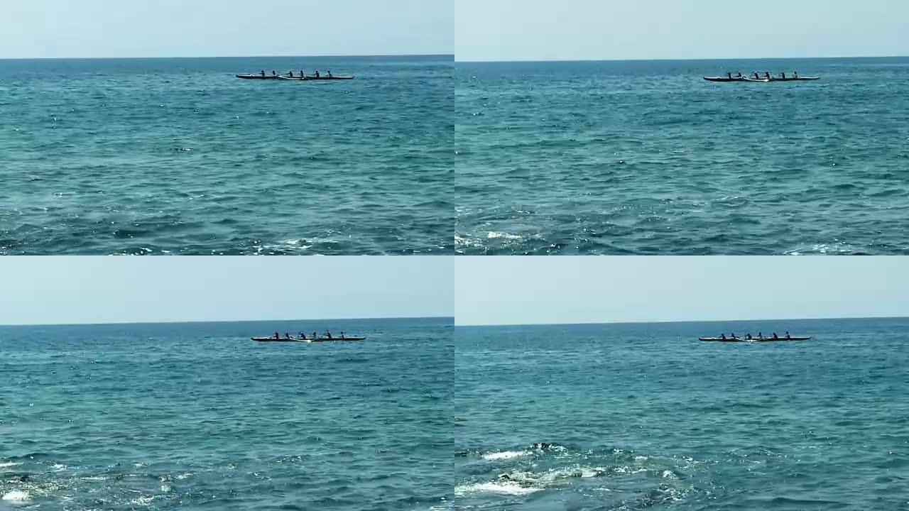 六人夏威夷独木舟在海洋中划桨
