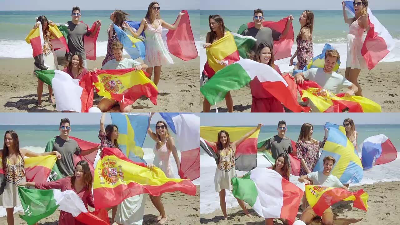 一群朋友在沙滩上踢足球和旗帜