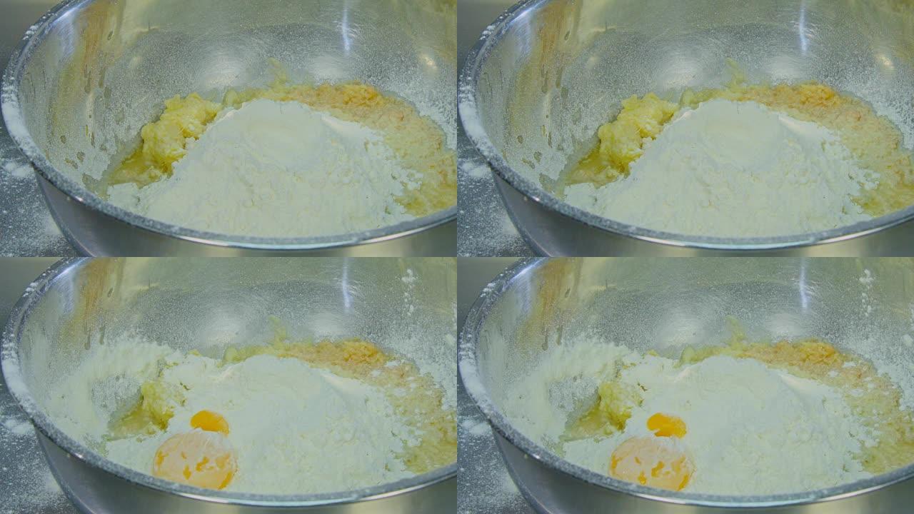 蛋黄落入面粉碗中