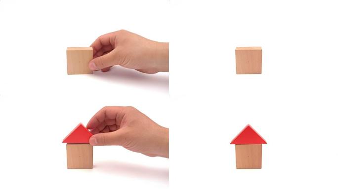 年轻人把玩具积木的形状像房子