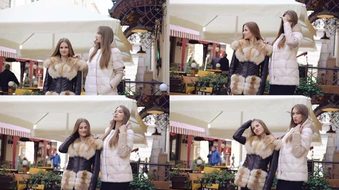时尚模特在全高清购物中心穿着皮大衣对着镜头摆姿势