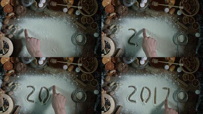 木制背景上的4k圣诞作文-在面粉上书写2017