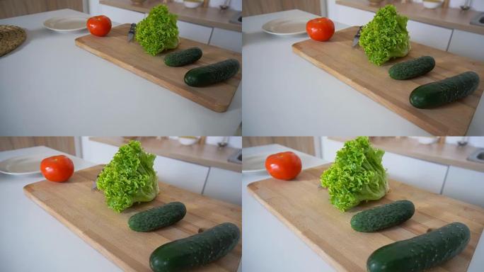 在时尚厨房的切菜板和厨房配件上拍摄新鲜蔬菜的特写镜头