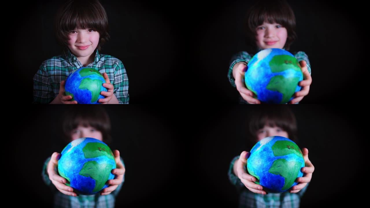 4k可爱的孩子手里拿着地球仪