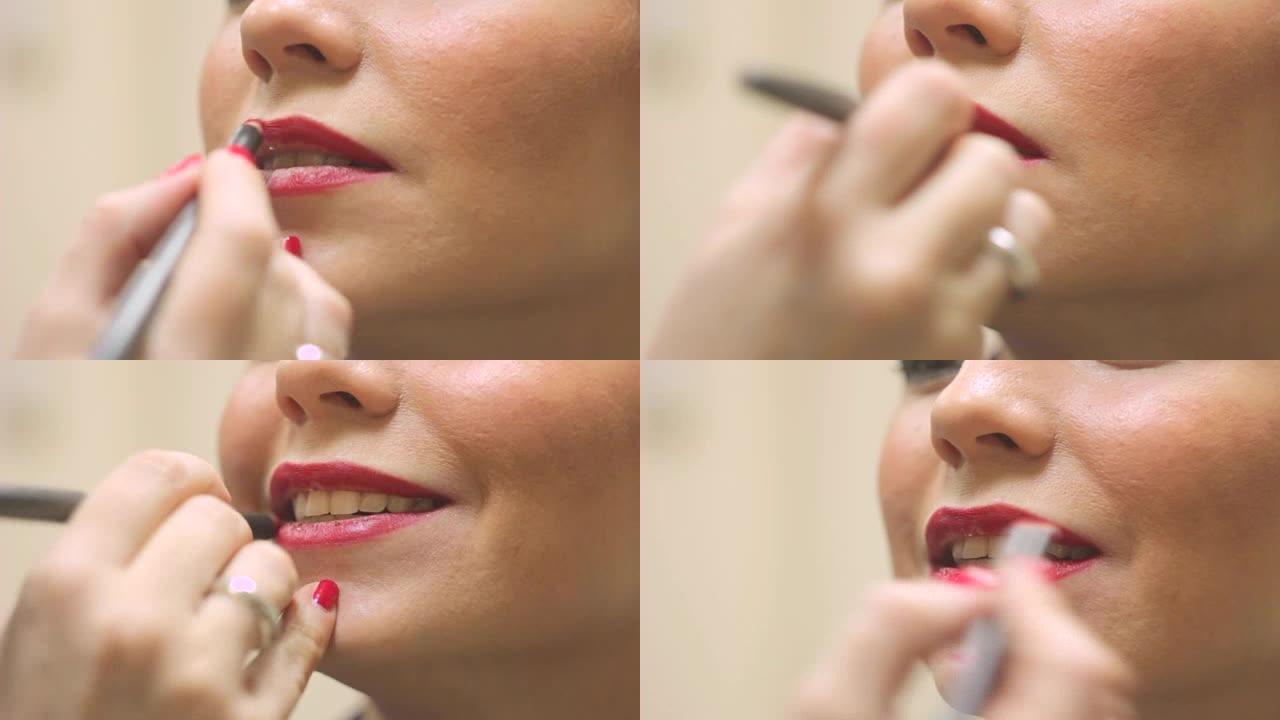 化妆师画她的嘴唇女人