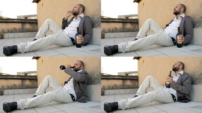 优雅的男人躺在地上喝酒和抽烟