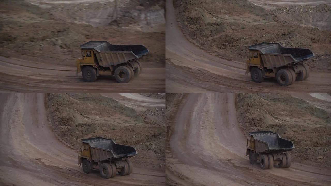 在阳光明媚的夏日，重型采矿卡车在露天采矿采石场运送货物。Bouxite采矿采石场。