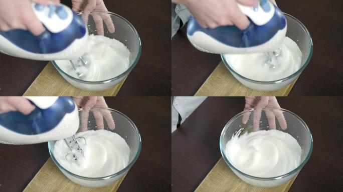 在玻璃碗中搅拌鸡蛋蛋白。用搅拌器搅拌蛋白质的过程