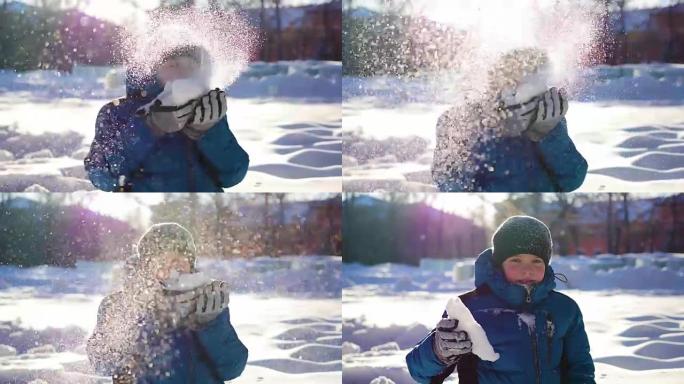 快乐的孩子在阳光明媚的日子在冬季公园玩得开心。吹雪从