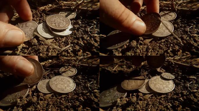 地上五枚不同面值的古俄国沙皇银币，手近看