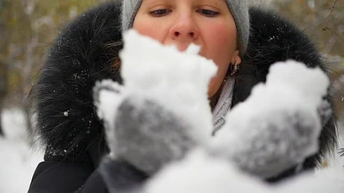 女孩在slowmo用手吹雪特写