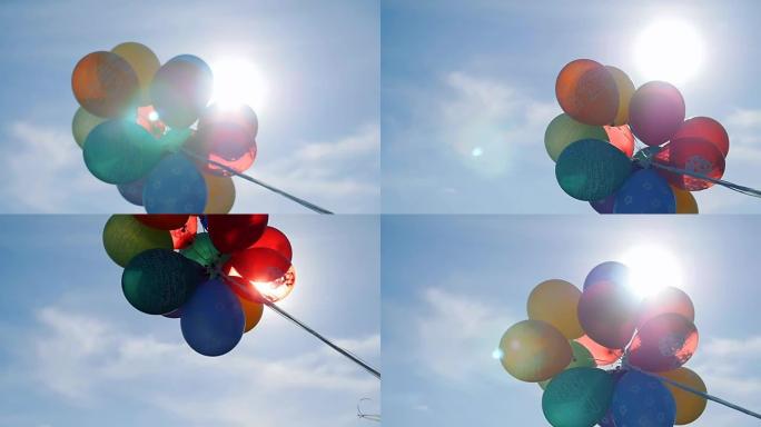 气球对着天空和太阳
