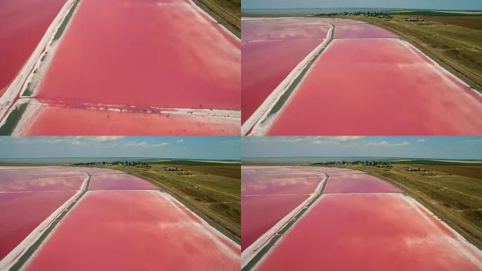 粉红色浮游生物色盐海水蒸发池的鸟瞰图