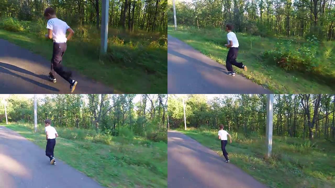瘦削的少年正在森林里的小径上奔跑。男孩被训练得很好。体育在本质上。