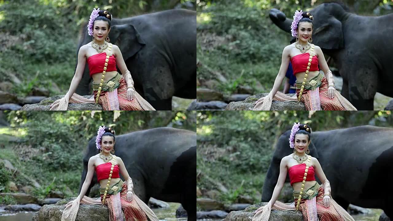 泰国清迈克里克有大象的亚洲妇女。