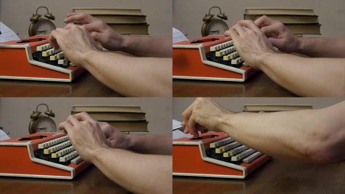 男人的手在红色复古打字机上打字