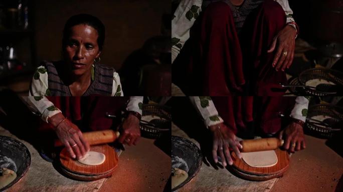 印度乡村妇女在传统炉子上做饭 (chulha)