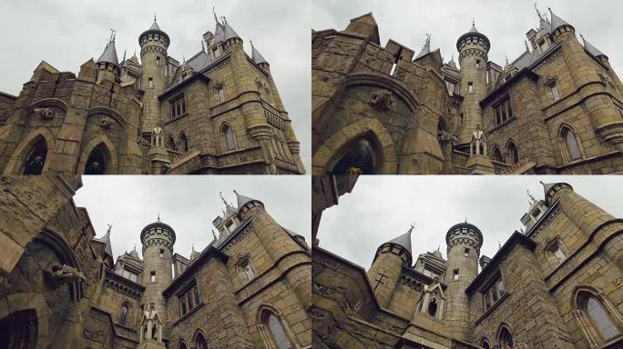 中世纪堡垒的塔楼，浅浮雕，石墙，彩色窗户，建筑中的哥特式风格