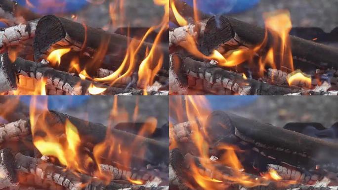 火在慢动作中燃烧，木头掉落