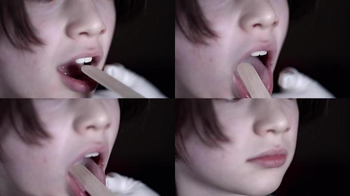 医生检查喉咙的4k特写儿童脸