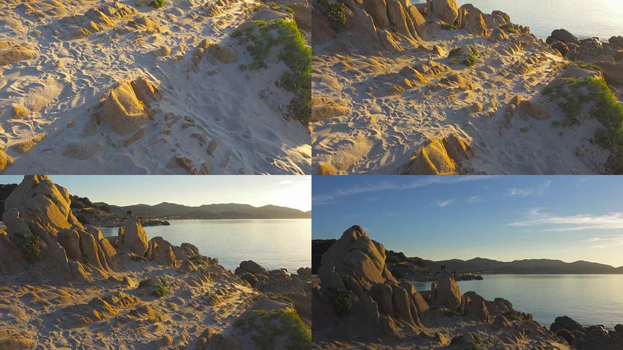 日出时在海边拍摄岩石