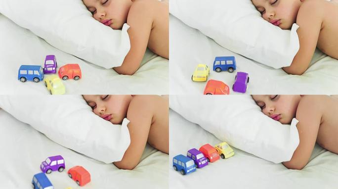 定格运动:一个孩子睡着了，一辆玩具车在移动