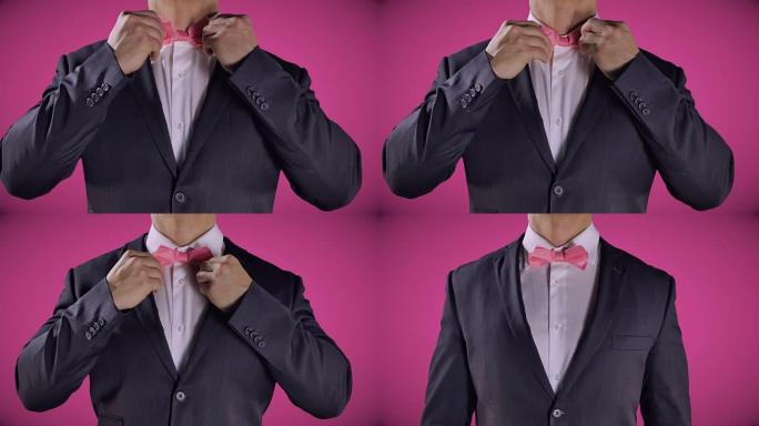粉色领结，穿着黑色燕尾服的男人，手，优雅的婚礼时尚