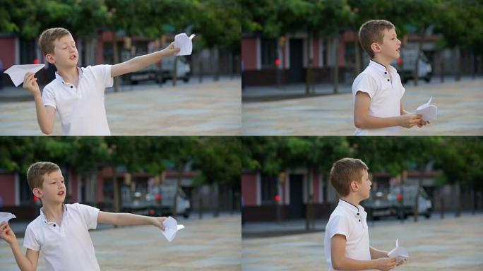 男孩玩简单的纸飞机