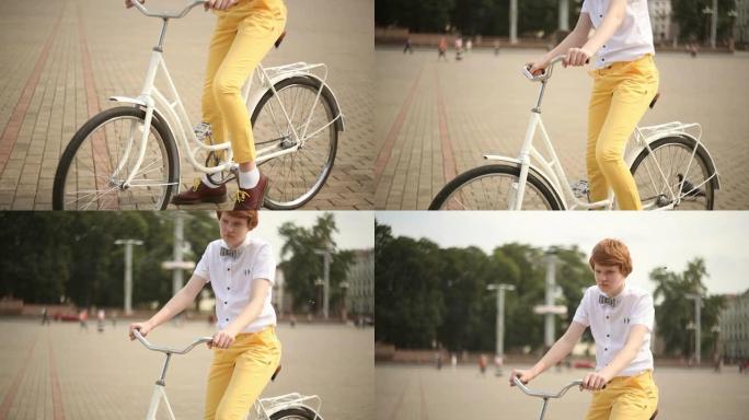 可爱的红发男孩，戴着老式自行车的蝴蝶
