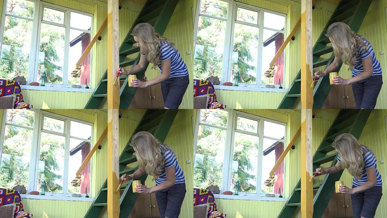 女农家女孩在花园房屋窗户前用刷子画木柱黄色。全高清