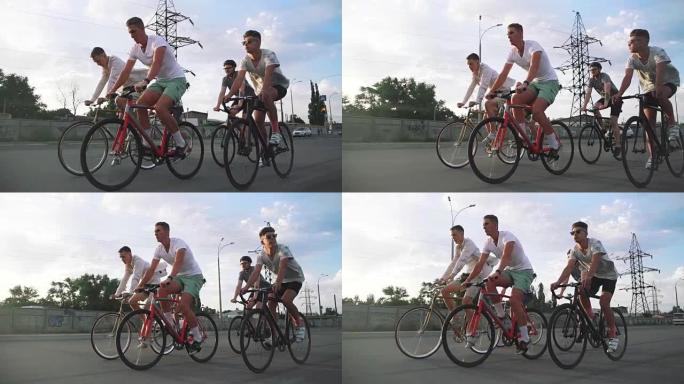 一群骑自行车的人在路上骑固定齿轮的自行车，稳定地射击，慢动作