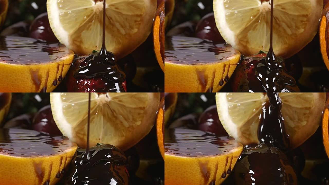 慢动作将巧克力糖浆倒在装有水果的盘子上